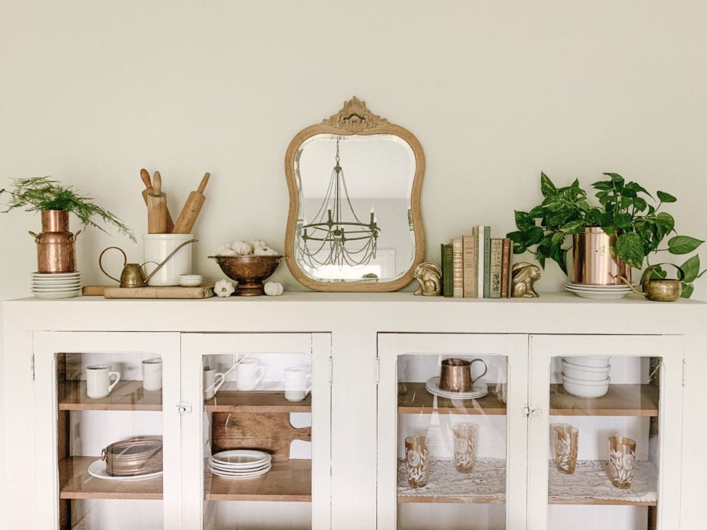 antiques displayed on cabinet for summer to fall decor