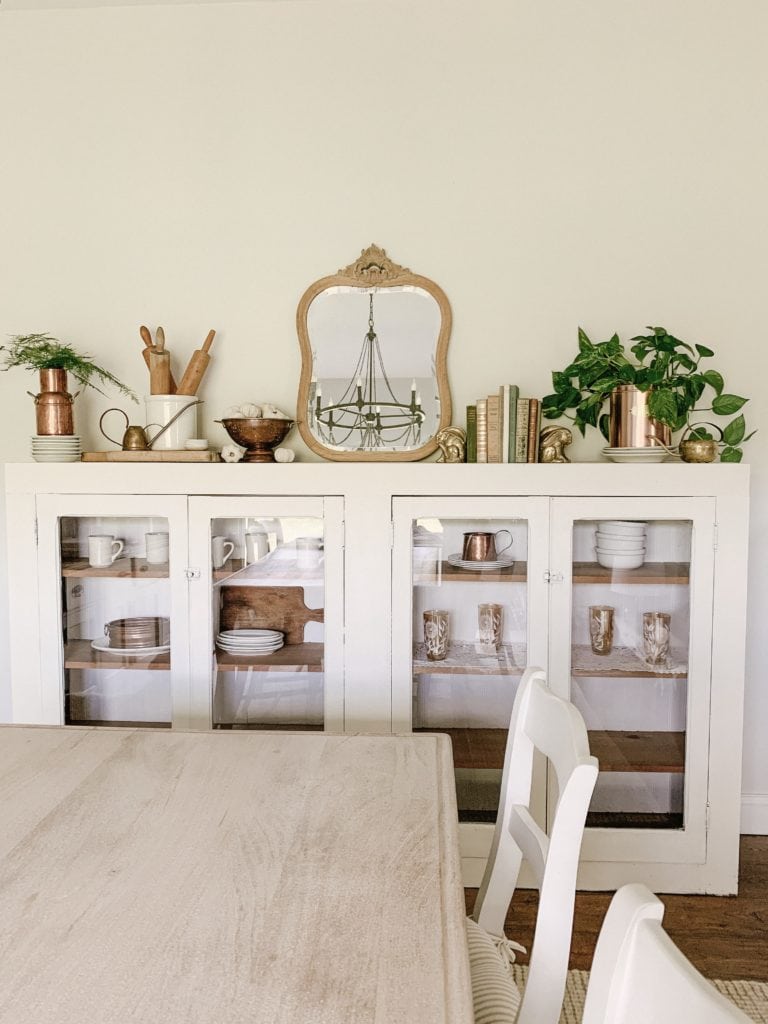 large glass door cabinet used in dining room buffet