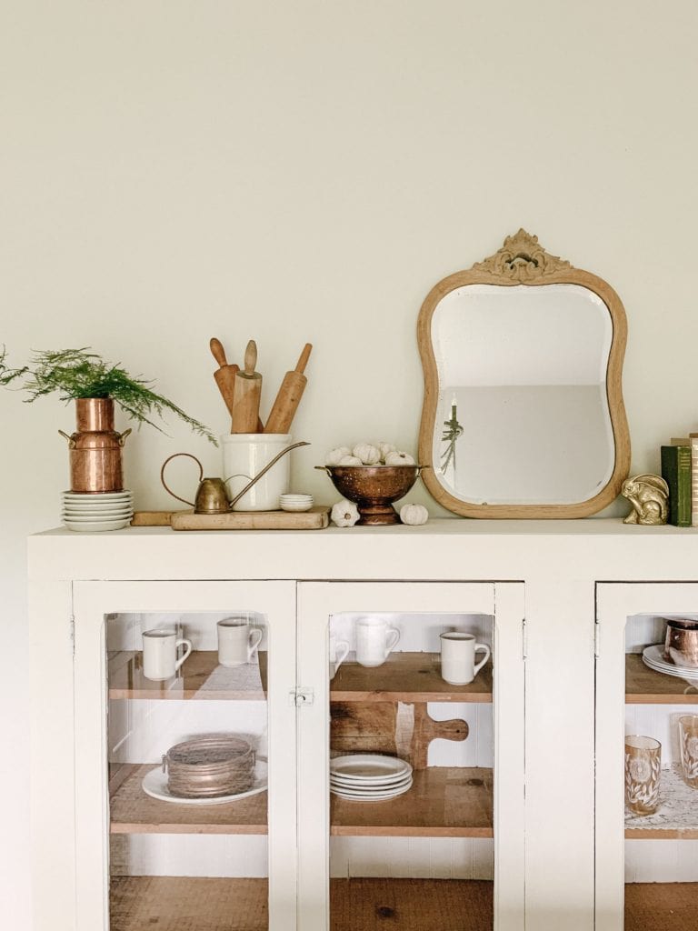 ironstone dishes in pine cabinet 