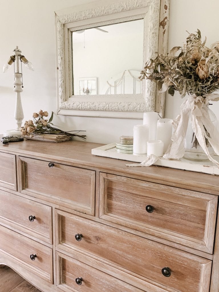 dried wedding bouquet displayed on bedroom dresser