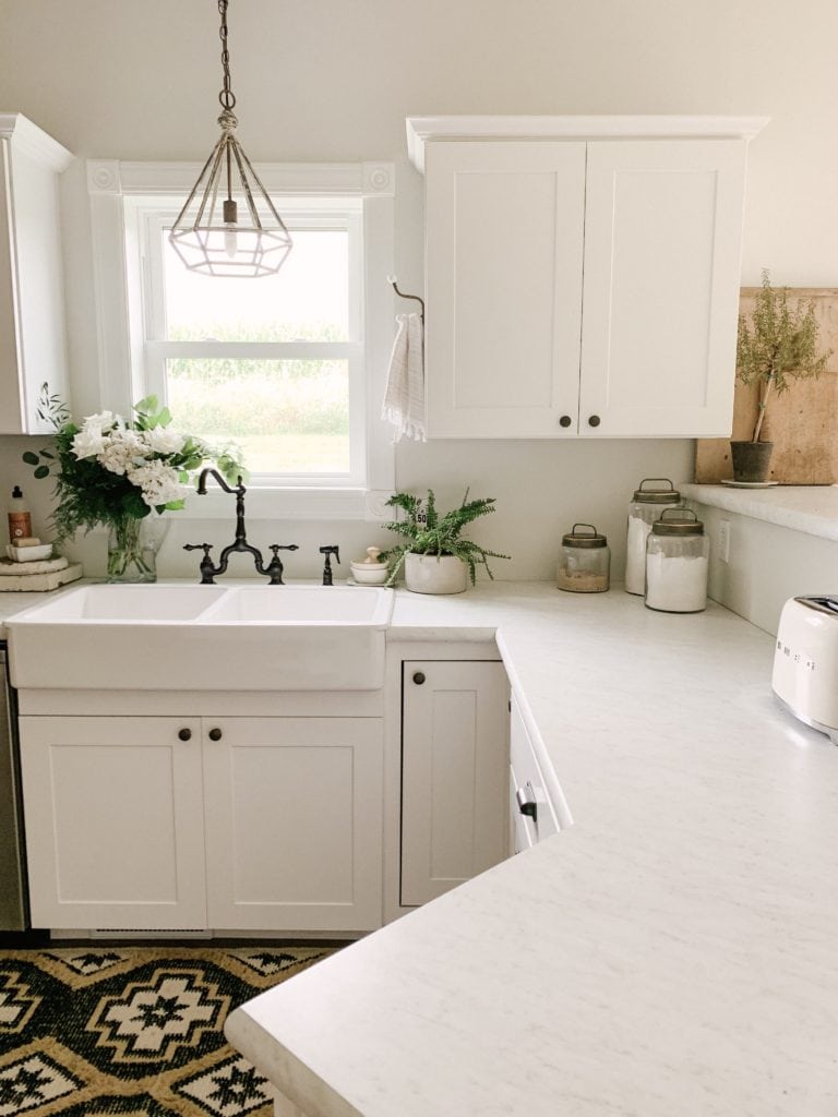 white farmhouse kitchen with hook for towel
