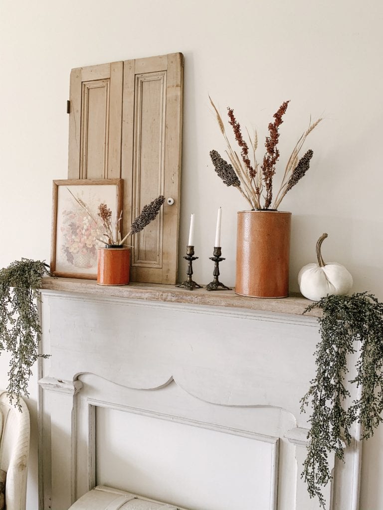 simple fall mantel decor using greenery and items from goodwill