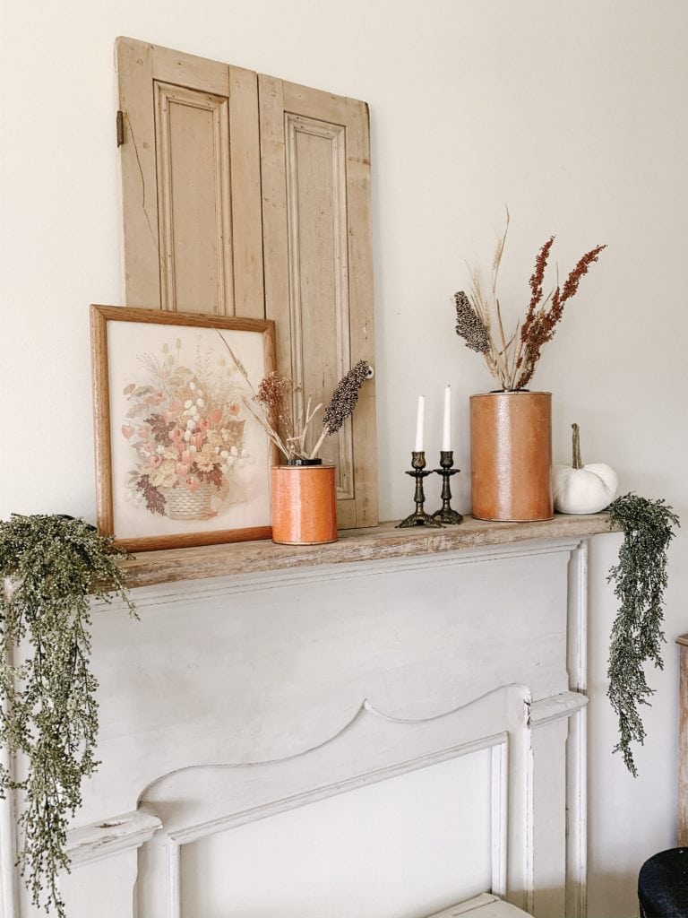 using finds from Goodwill to decorate a mantle for the fall season