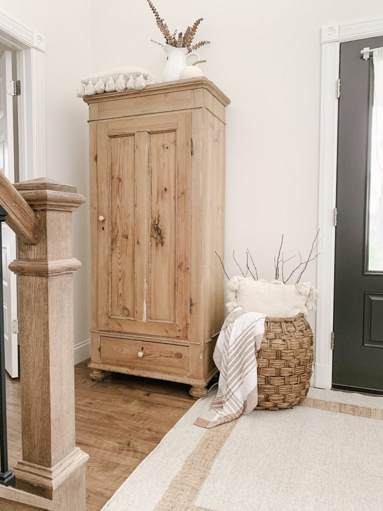 old wooden cabinet in foyer of modular home