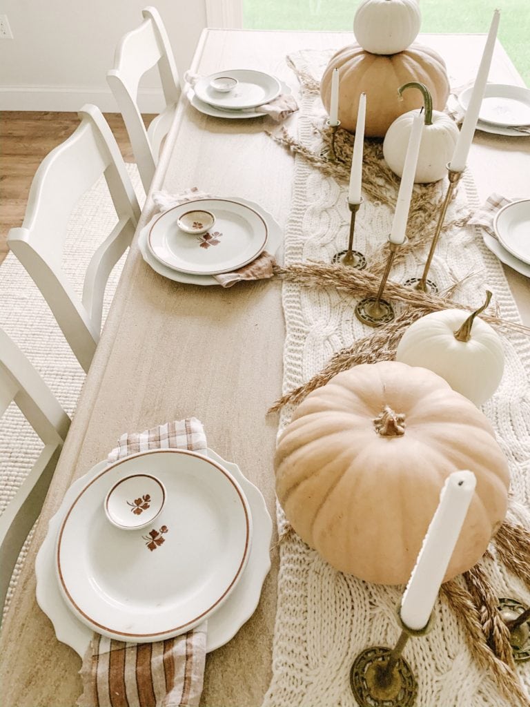 thanksgiving table setting inspiration using pumpkins and candlesticks