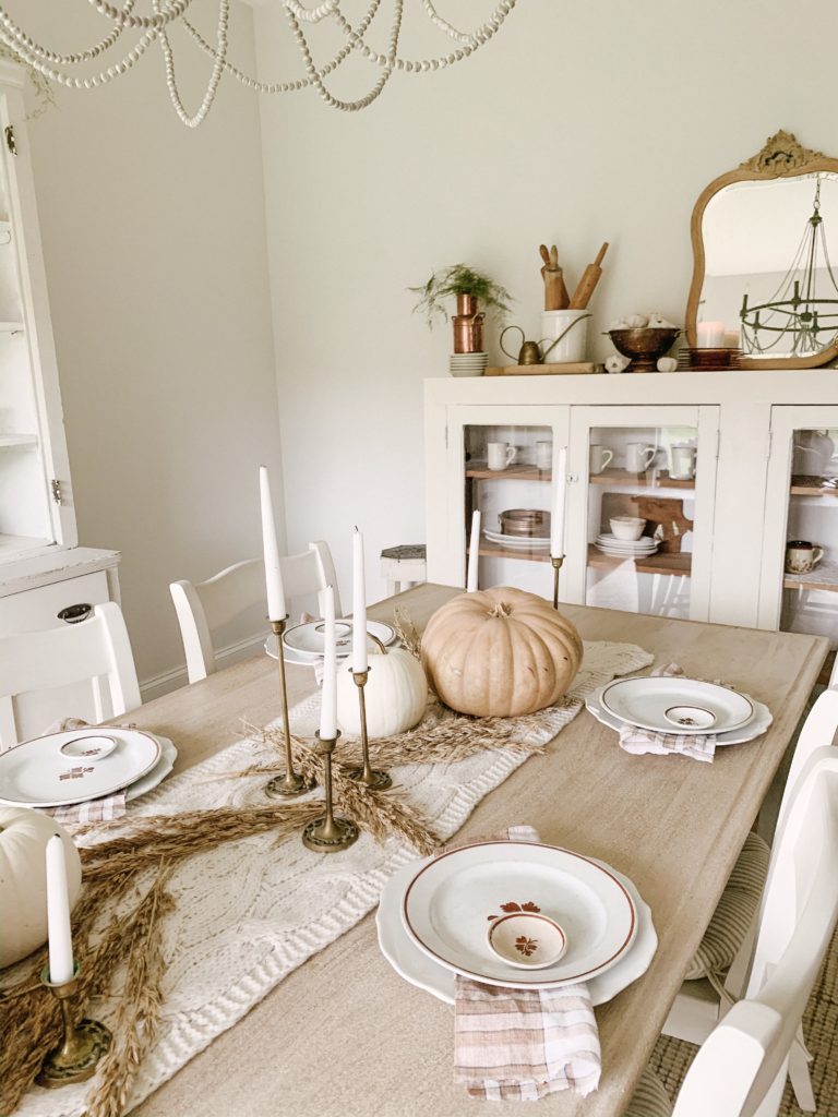 decorating your table for thanksgiving dinner with neutral harvest colors