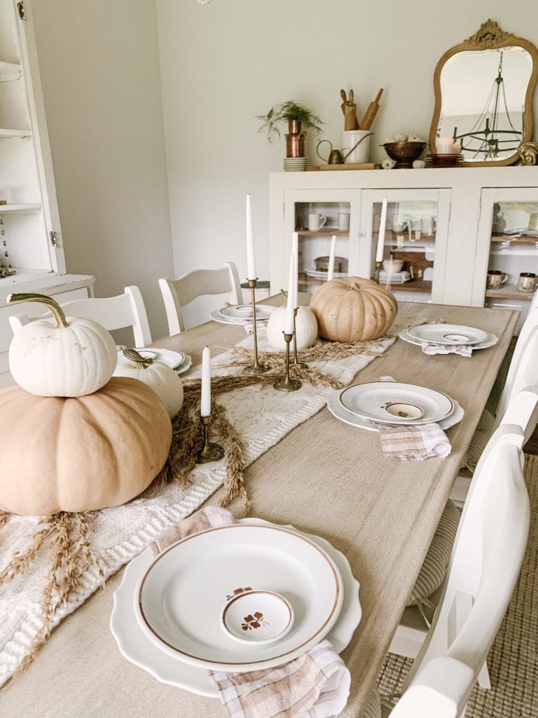 thanksgiving dinner table inspiration using neutral colors and pumpkins