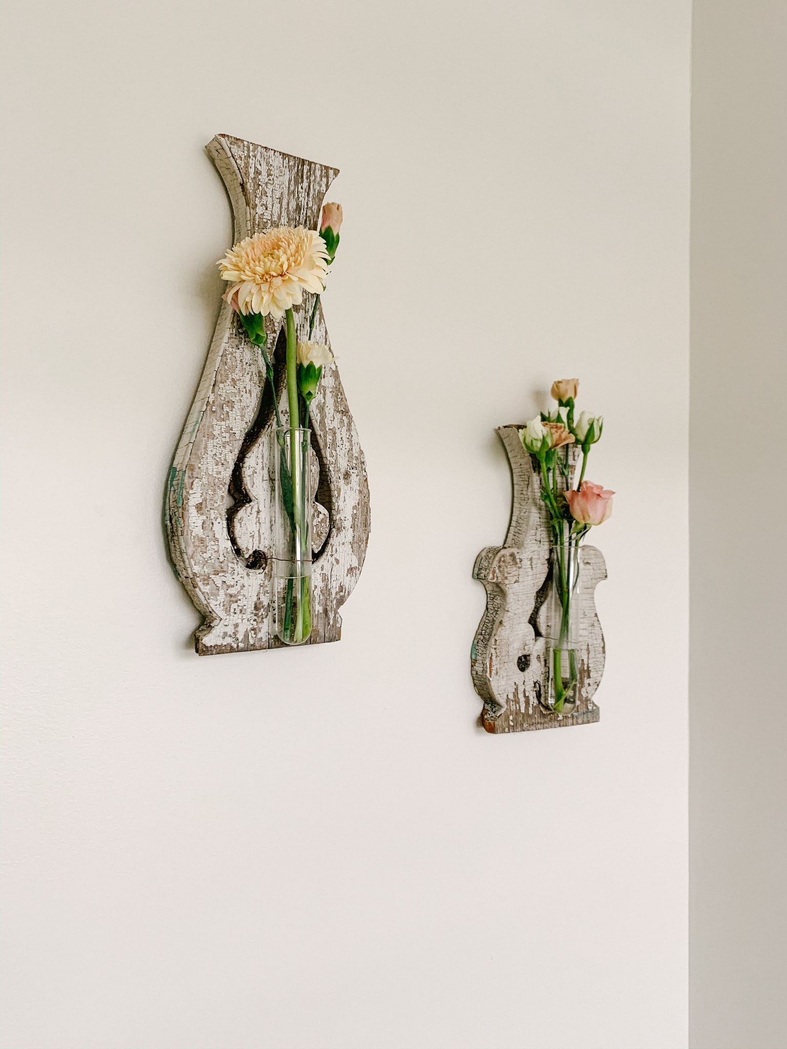 mini roses in wall sconces