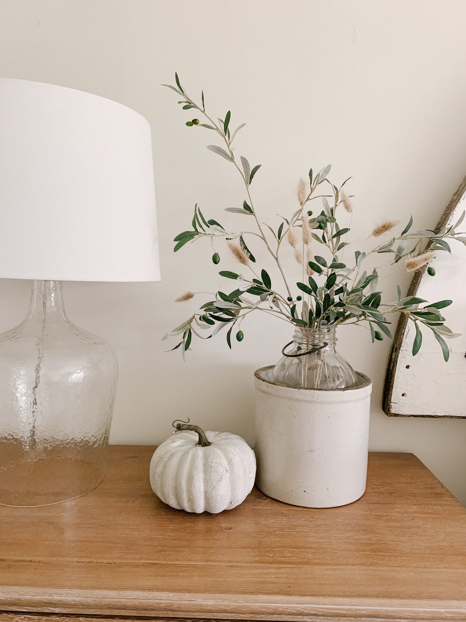 subtle fall decor in bedroom with earthy textured faux pumpkin