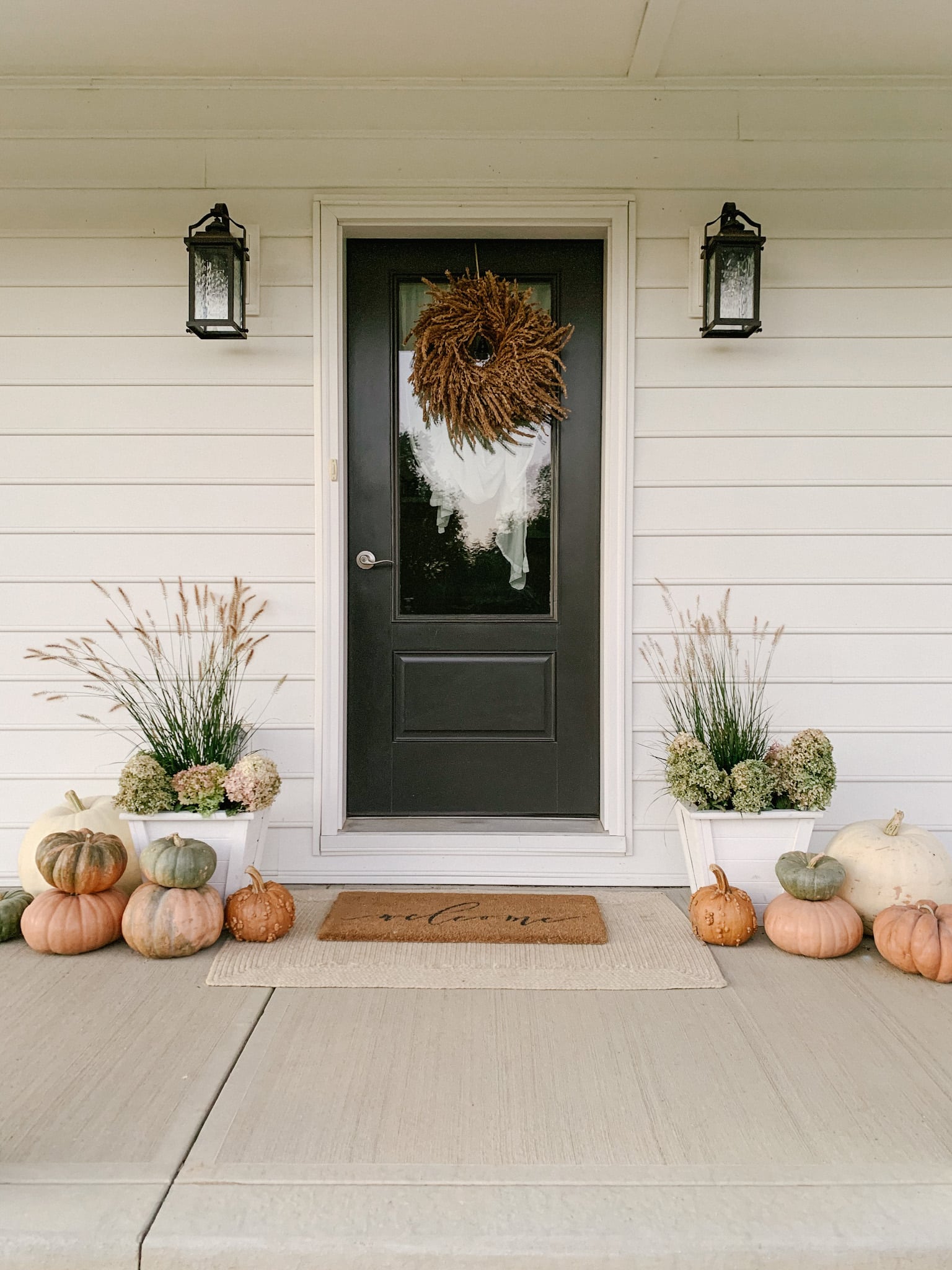 fall porch with dried hydrangeas and grass